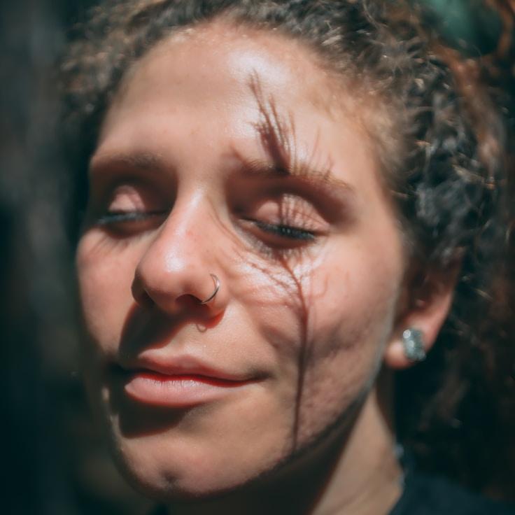 Kaveri Mehta, Lead Design Curator at Studio Harvest Grove, reviewing corporate floral arrangements